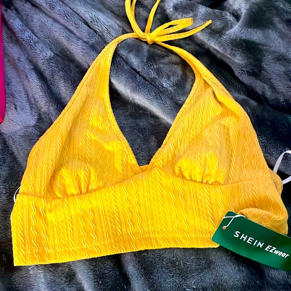 Yellow halter top
Ties at the neck 
Deep V neck